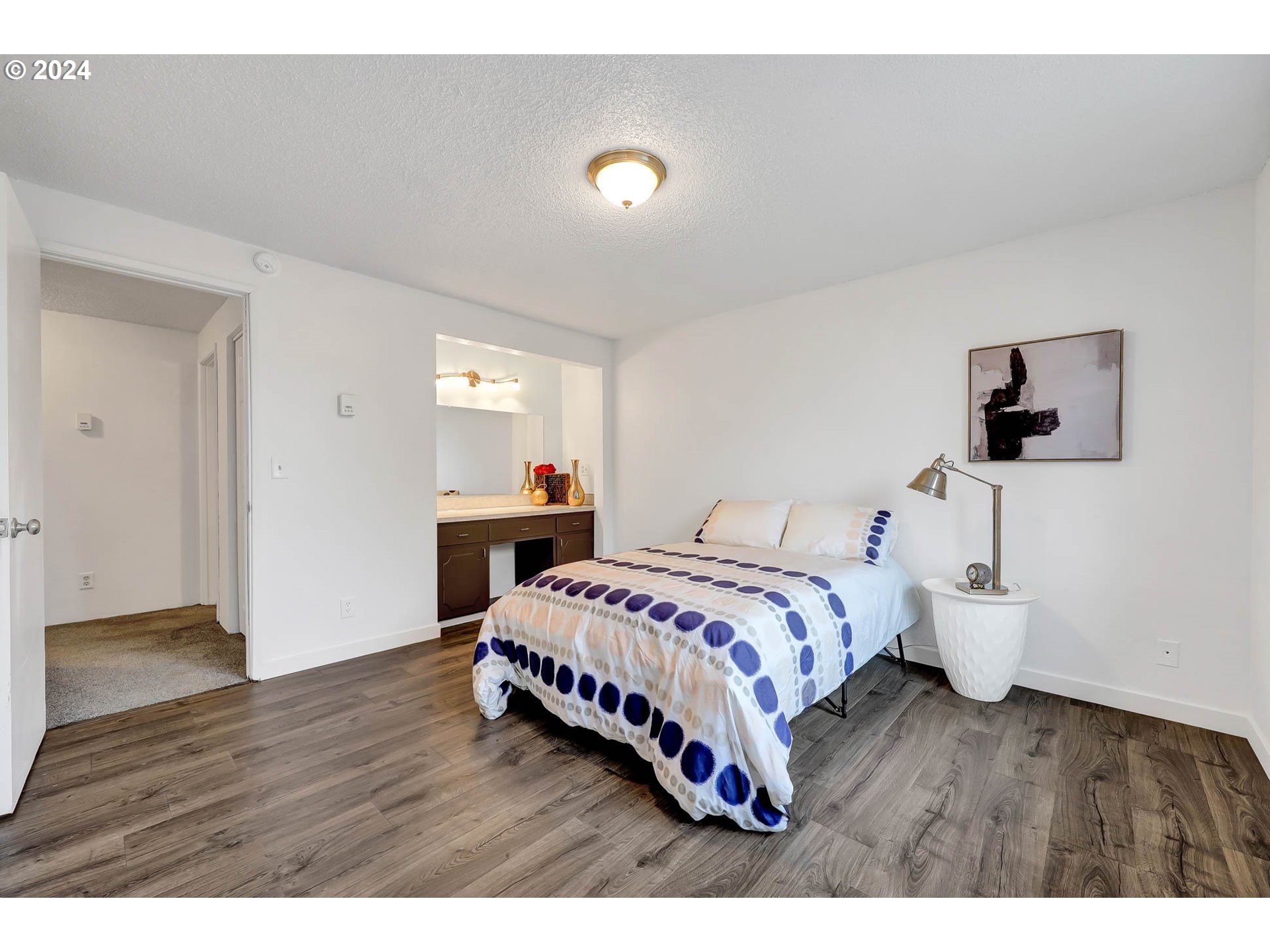 4250 Scenic Drive Eugene, OR 97404 - Photo 13 of 31 a bedroom with a bed and a night stand