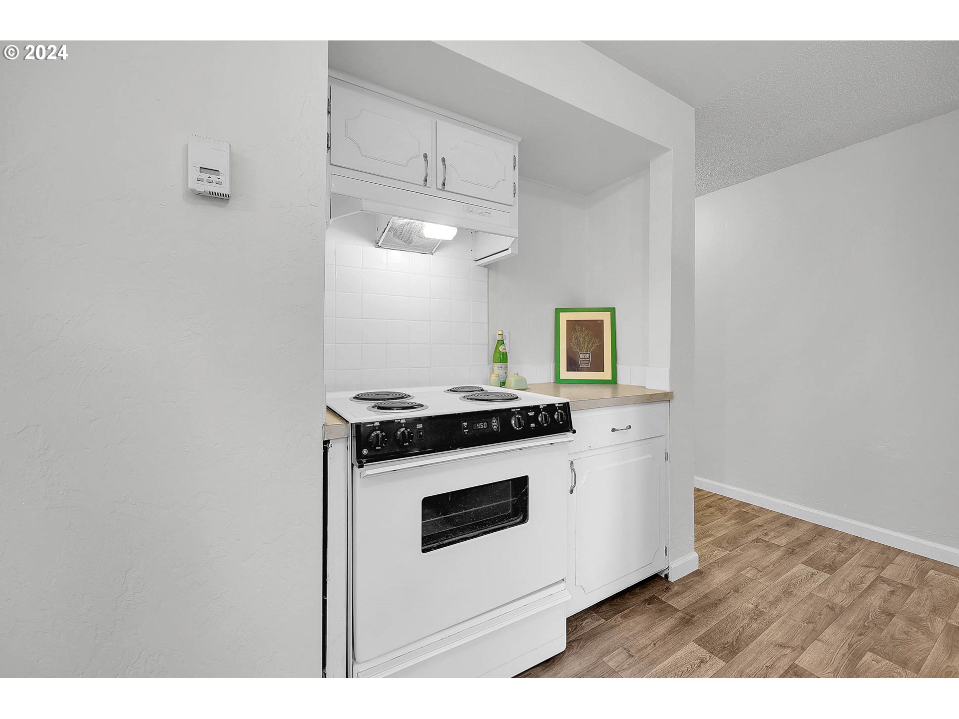 4250 Scenic Drive Eugene, OR 97404 - Photo 24 of 31 a kitchen with a stove and a microwave