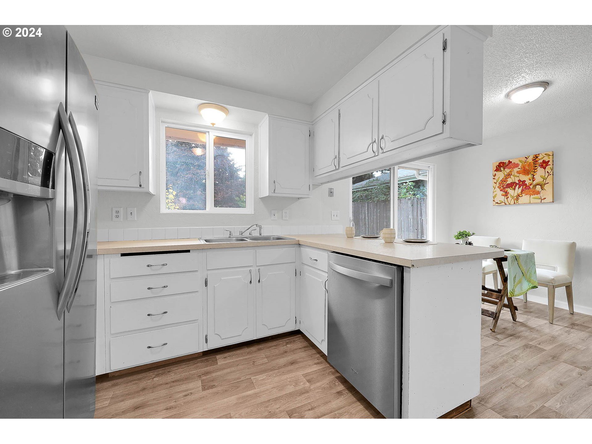 4250 Scenic Drive Eugene, OR 97404 - Photo 25 of 31 a kitchen with cabinets appliances and a window