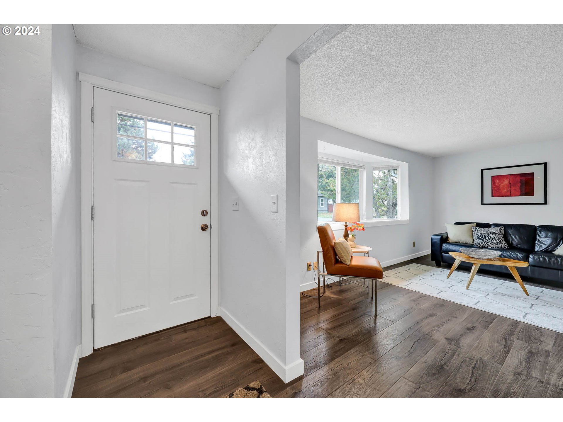 4250 Scenic Drive Eugene, OR 97404 - Photo 3 of 31 a living room with furniture a rug and a window