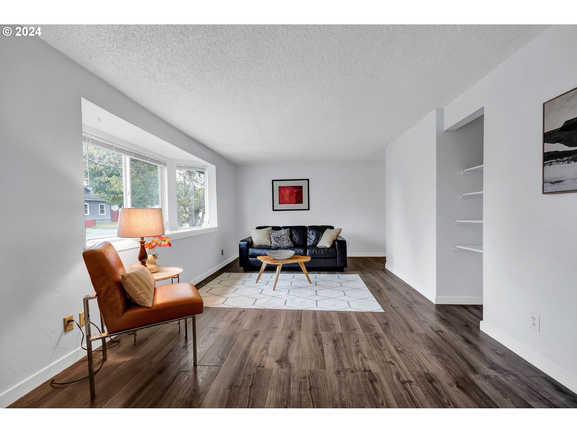 4250 Scenic Drive Eugene, OR 97404 - Photo 4 of 31 a living room with furniture and a wooden floor