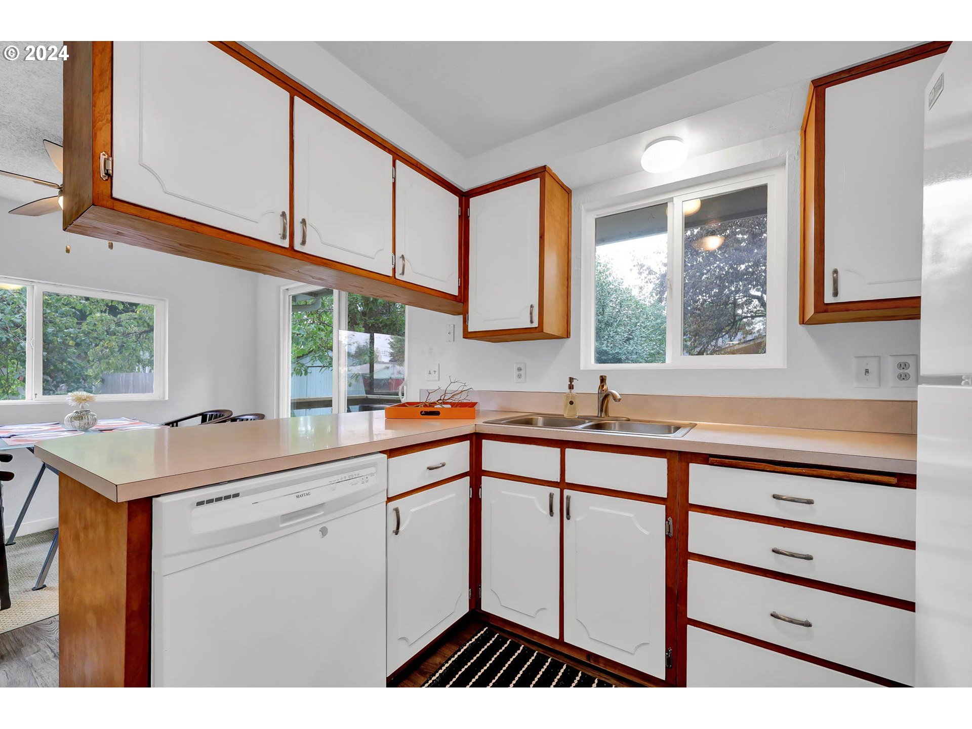 4250 Scenic Drive Eugene, OR 97404 - Photo 9 of 31 a kitchen with a sink window and cabinets