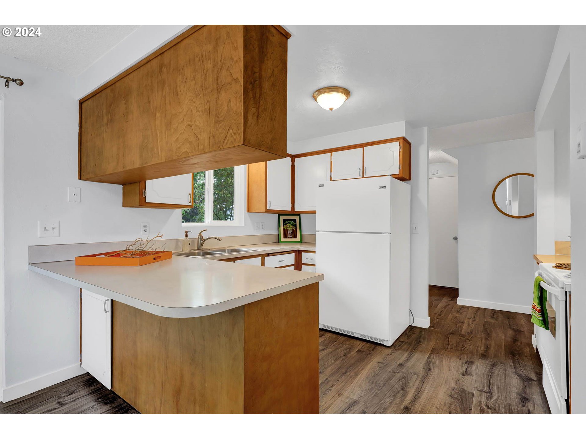 4250 Scenic Drive Eugene, OR 97404 - Photo 10 of 31 a kitchen with a sink a refrigerator and a stove