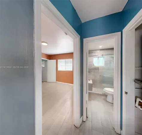 a bathroom with a glass shower door