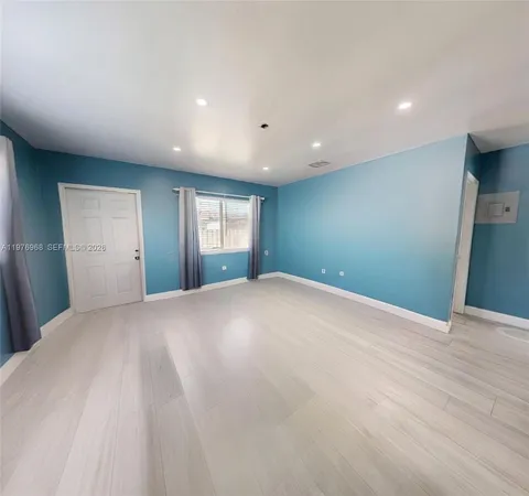 a view of empty room with windows