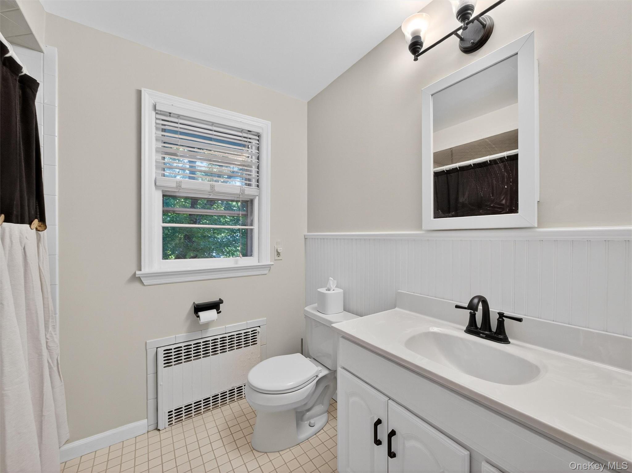 2 Beech Road Suffern, NY 10901 - Photo 11 of 24 a bathroom with a toilet a sink and a window