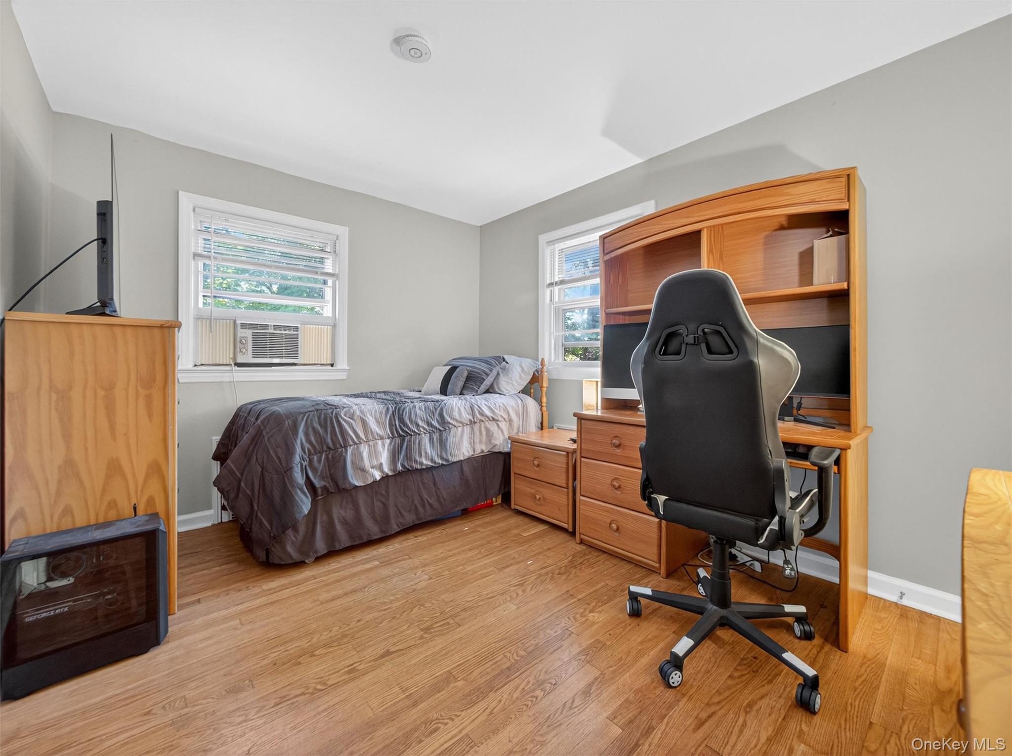 2 Beech Road Suffern, NY 10901 - Photo 12 of 24 a bedroom with a bed and a desk