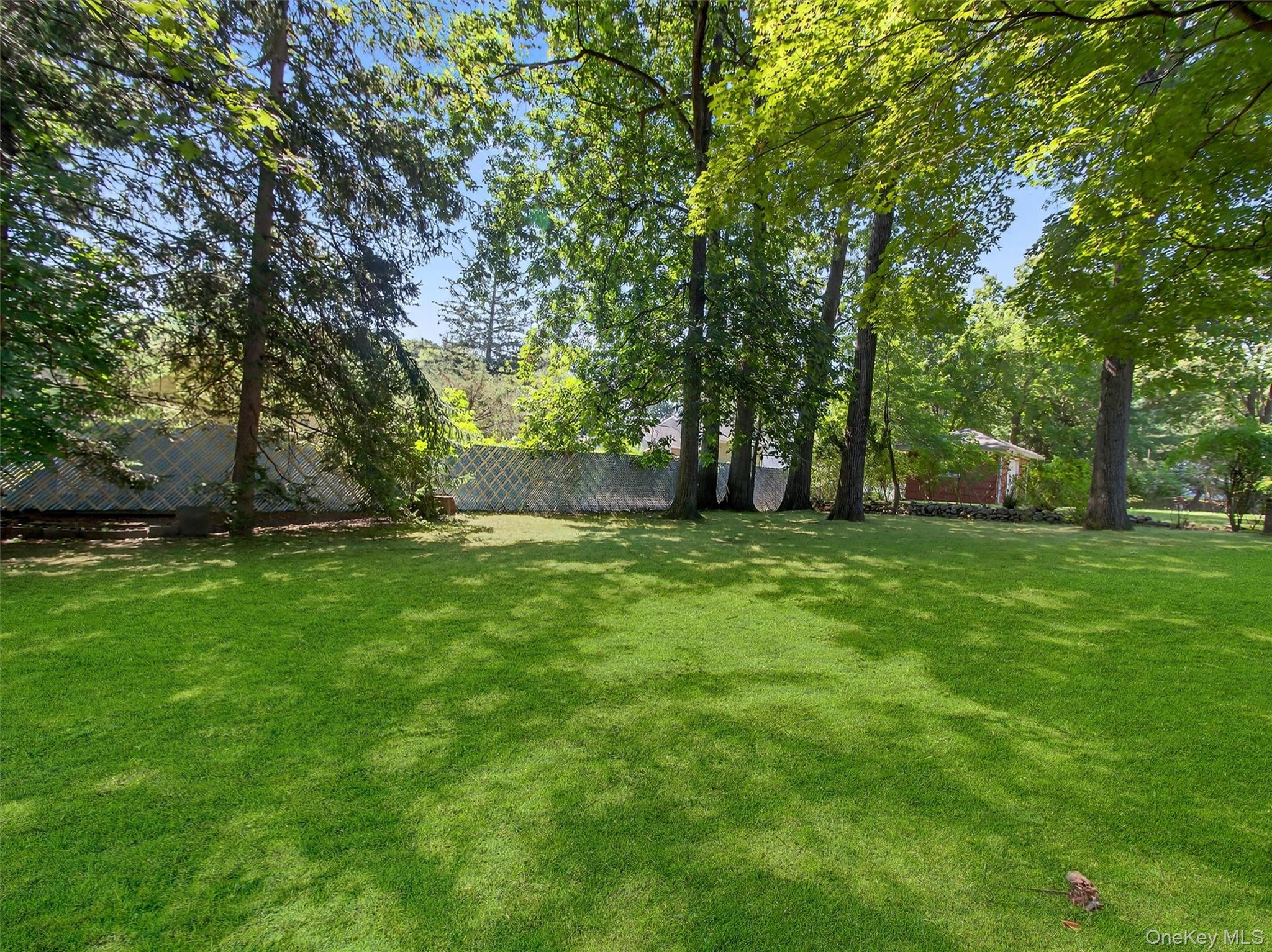 2 Beech Road Suffern, NY 10901 - Photo 21 of 24 a view of outdoor space with deck and trees