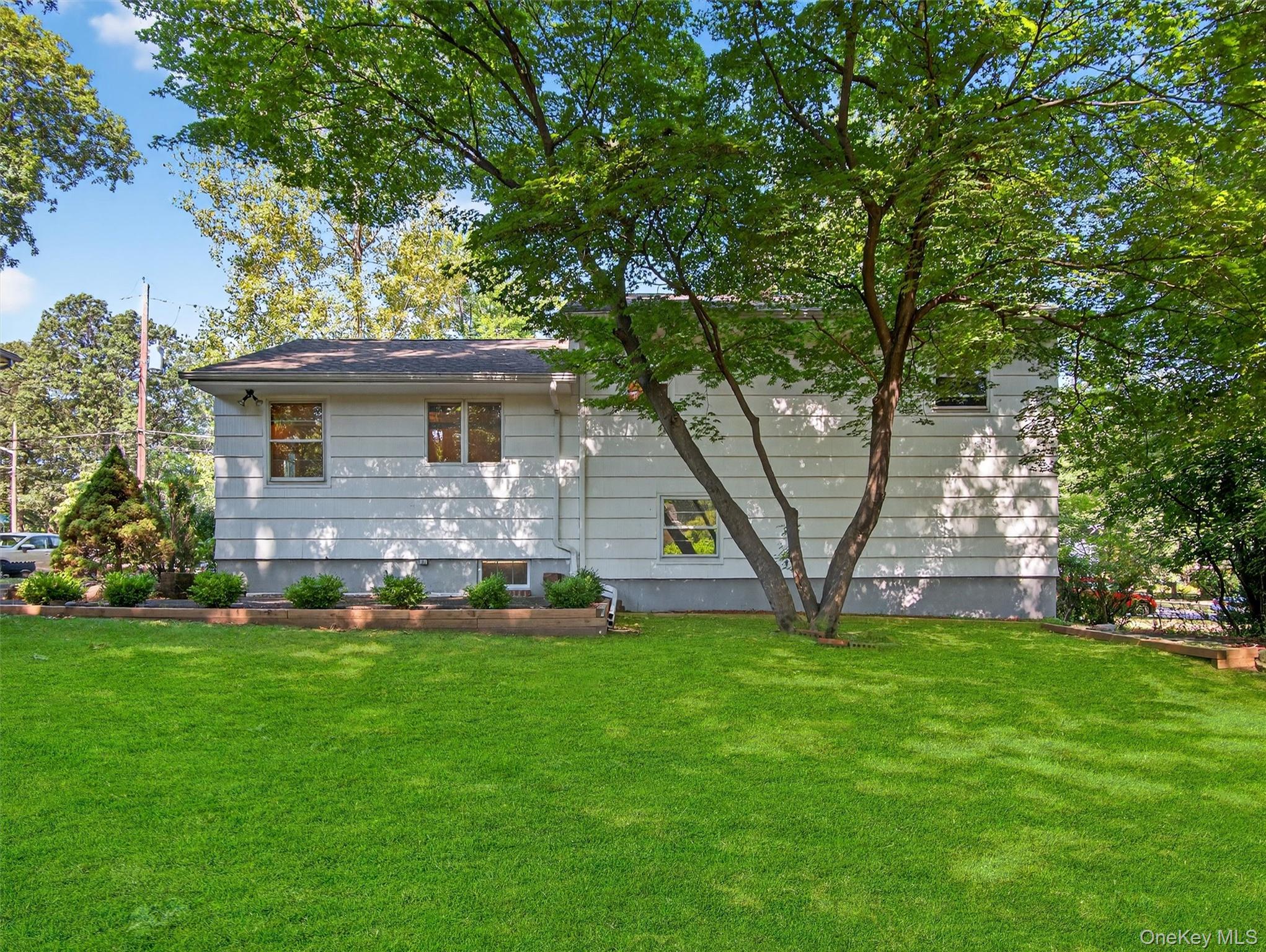 2 Beech Road Suffern, NY 10901 - Photo 22 of 24 a front view of house with a garden