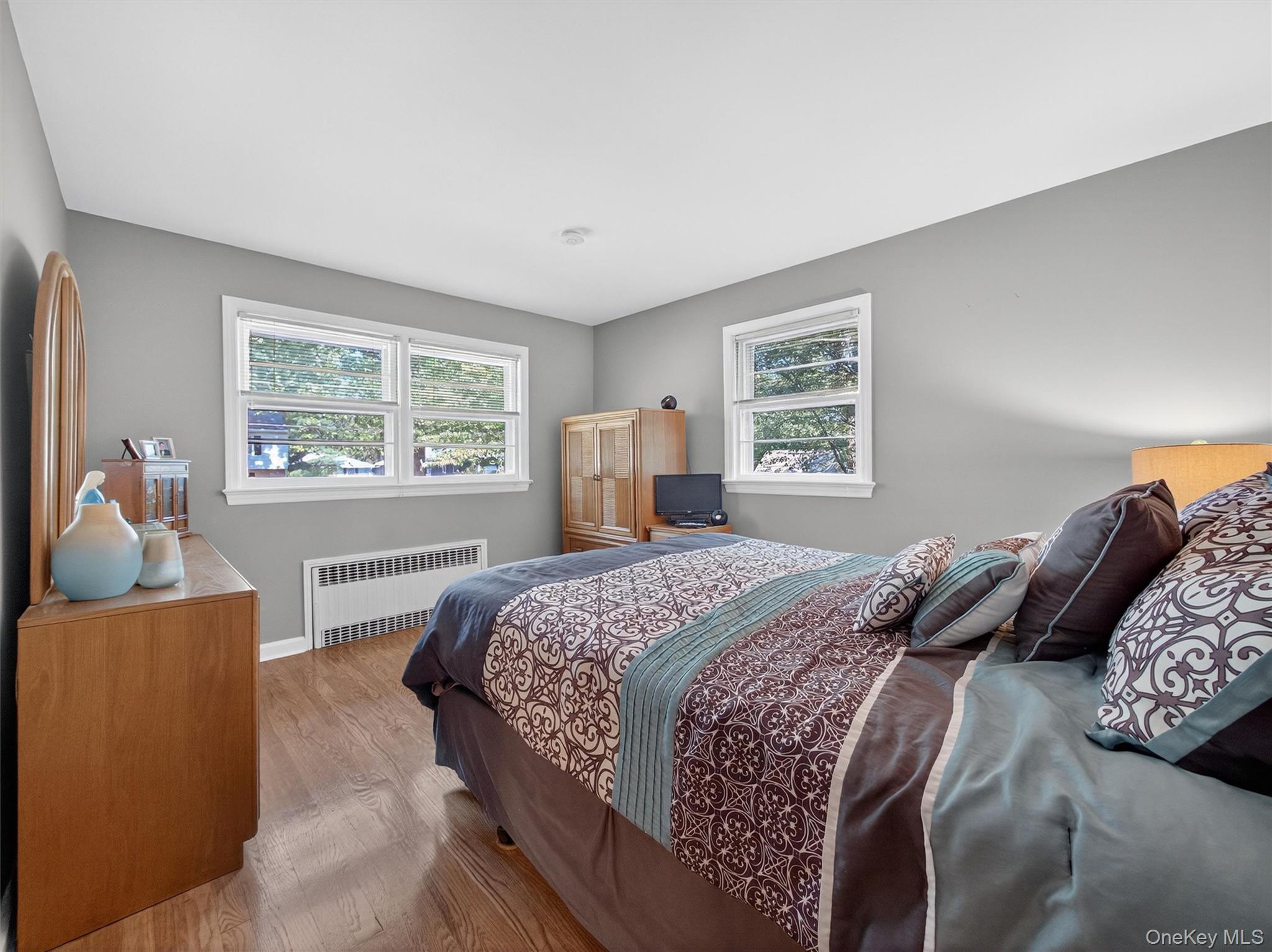 2 Beech Road Suffern, NY 10901 - Photo 10 of 24 a bedroom with a large bed and a window