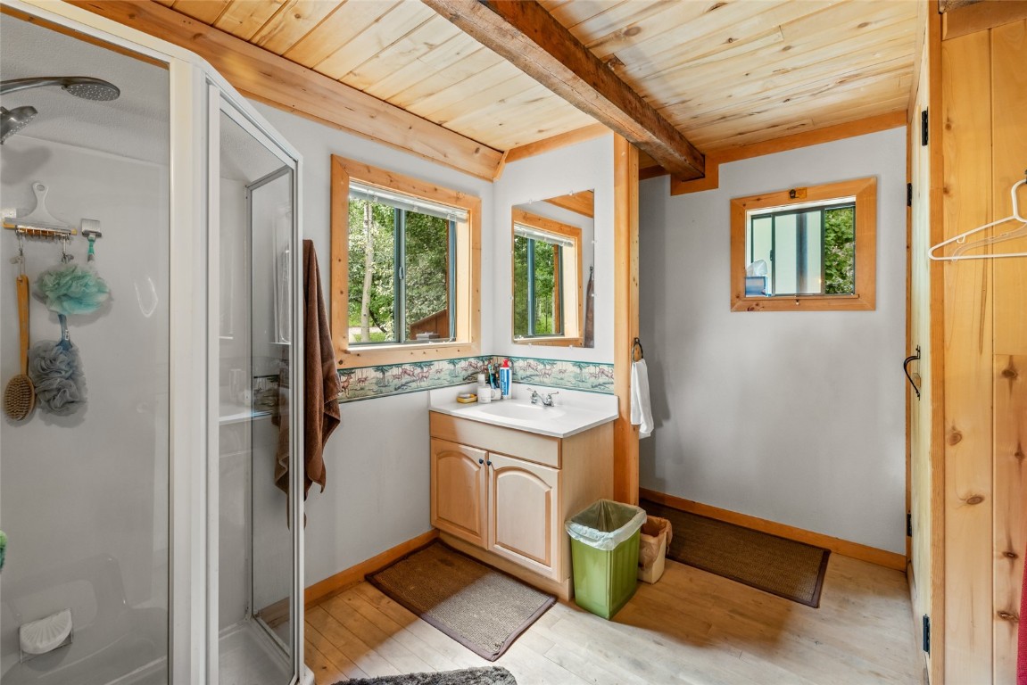 389 Routt Forest Loop Craig, CO 81625 - Photo 24 of 49 a view of a bathroom with a sink and mirror