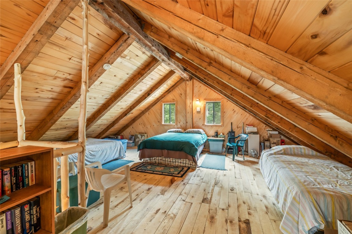 389 Routt Forest Loop Craig, CO 81625 - Photo 28 of 49 a bedroom with furniture and a book shelf