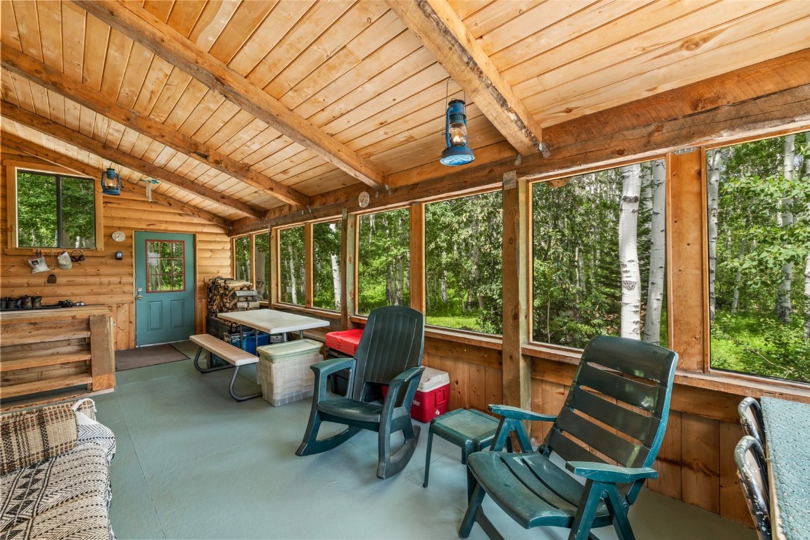 389 Routt Forest Loop Craig, CO 81625 - Photo 33 of 49 a view of a patio with table and chairs and potted plants