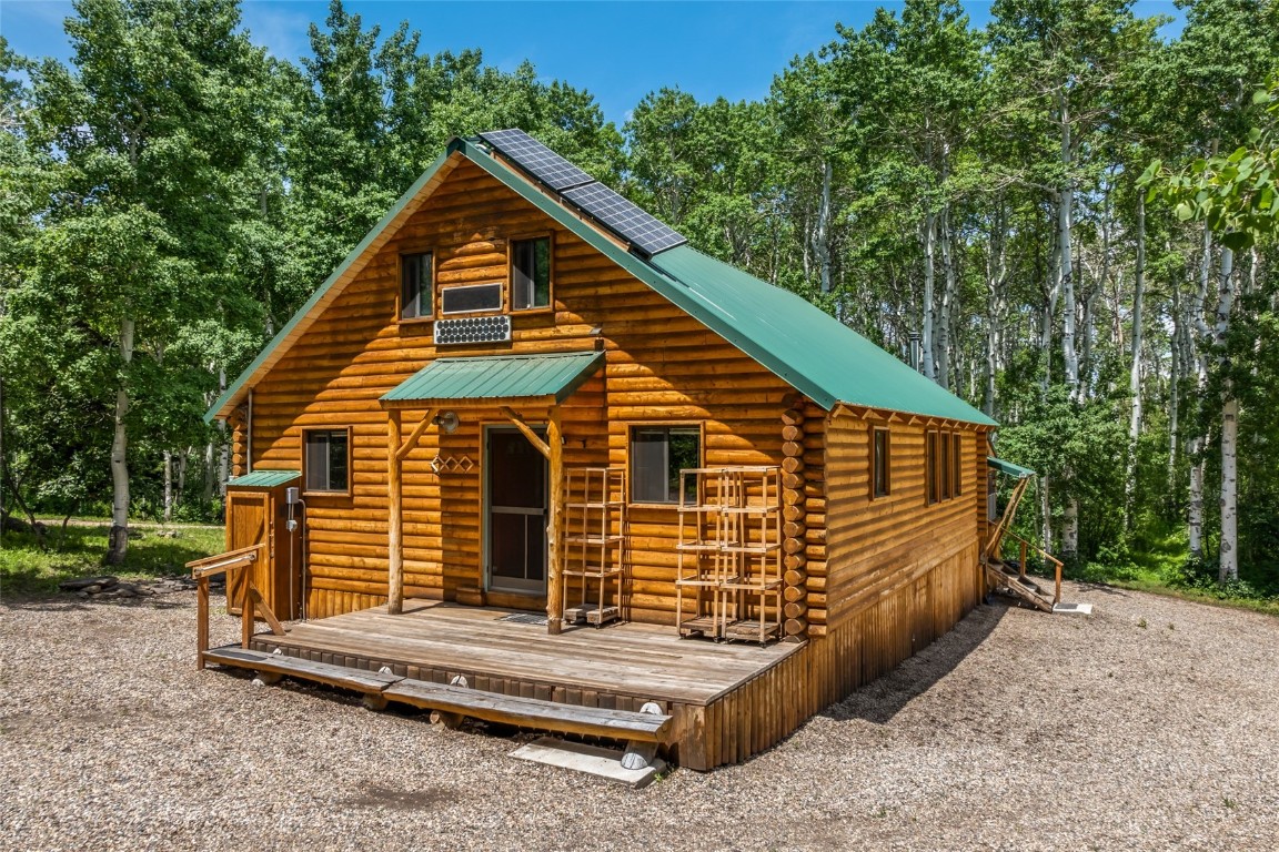 389 Routt Forest Loop Craig, CO 81625 - Photo 36 of 49 a view of a house with a yard