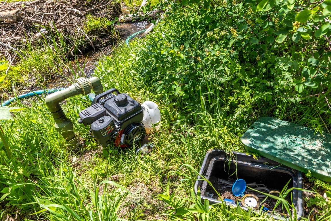 389 Routt Forest Loop Craig, CO 81625 - Photo 49 of 49 a backyard of a house with table and chairs