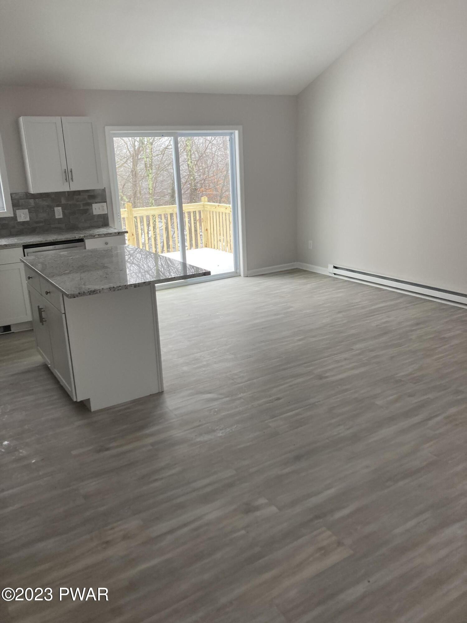 115 Beach Road Milford, PA 18337 - Photo 10 of 12 wooden floor in an empty room with a window