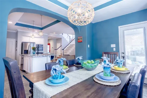 a kitchen with a sink a counter top space stainless steel appliances and cabinets