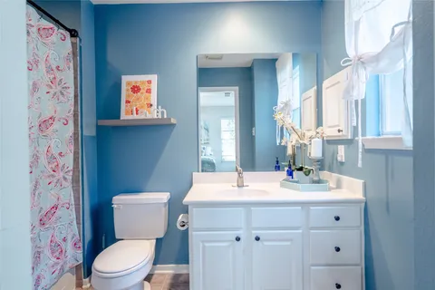 a living room with furniture and stairs