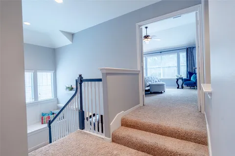 a bedroom with a bed and flowerpot
