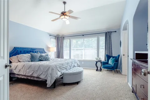 a bathroom with a sink a toilet a shower and a mirror