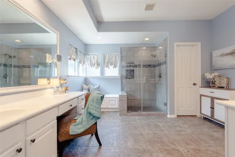 a room with a sink and a mirror