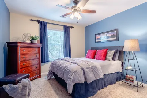 a bathroom with a sink vanity tub and toilet
