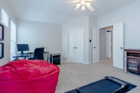 a room with a window and gym equipment