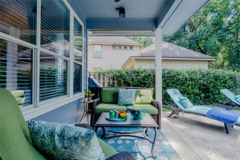 a view of a swimming pool with a outdoor seating