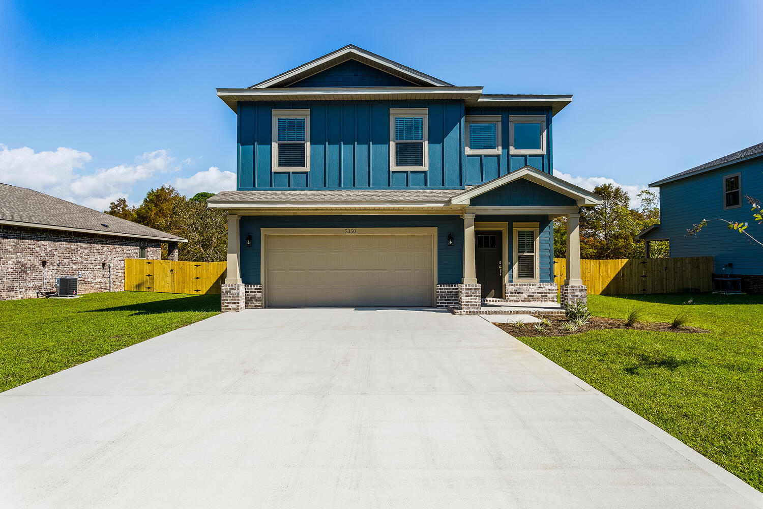 6695 Rocky Shores Road Milton, FL 32583 - Photo 1 of 53 a front view of a house with garden