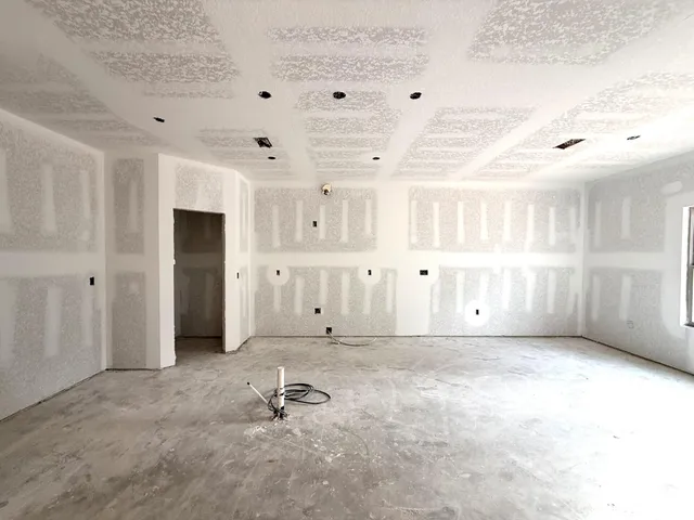 a kitchen with stainless steel appliances granite countertop a sink a stove a refrigerator and island with wooden floor