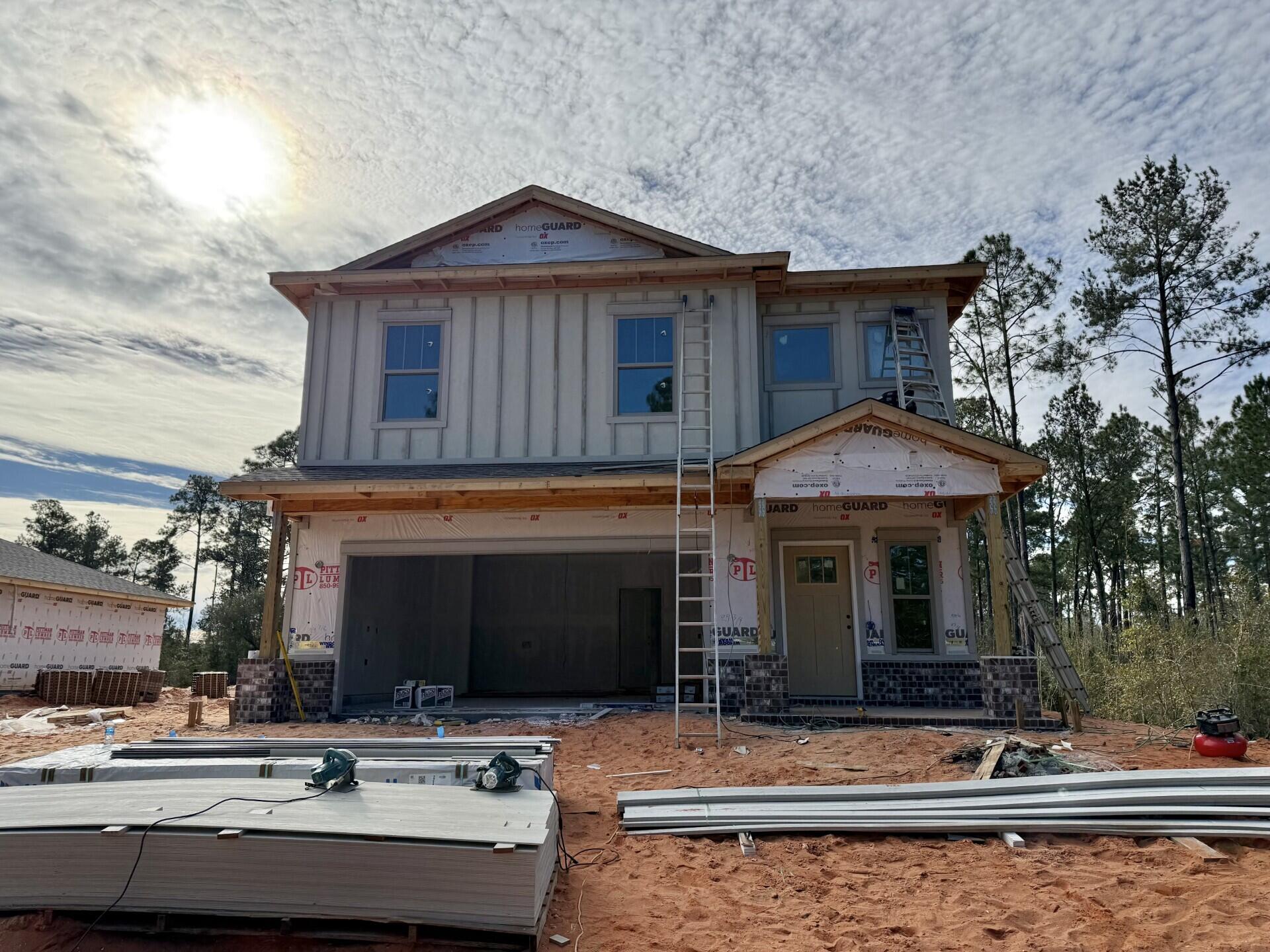 6695 Rocky Shores Road Milton, FL 32583 - Photo 2 of 53 a front view of a house with swimming pool