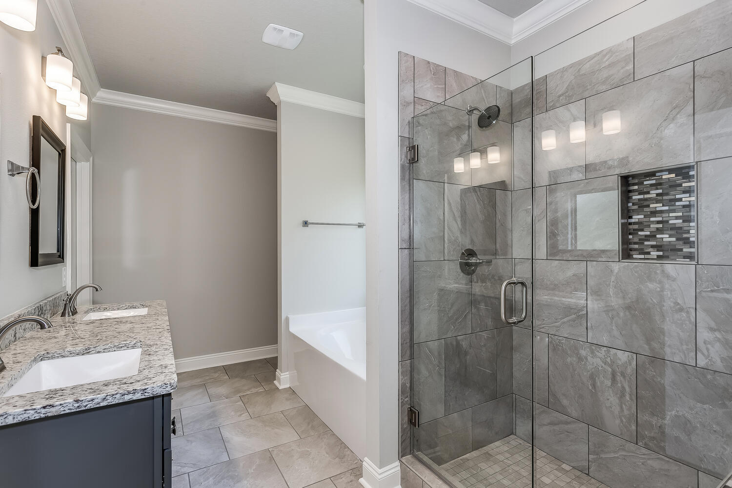 6695 Rocky Shores Road Milton, FL 32583 - Photo 24 of 53 a bathroom with a granite countertop shower sink and mirror