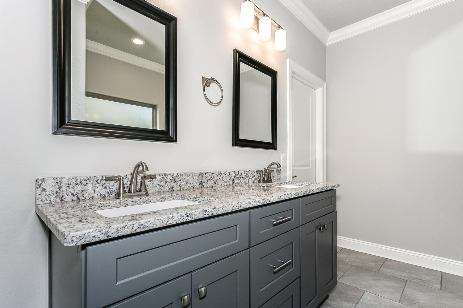 6695 Rocky Shores Road Milton, FL 32583 - Photo 26 of 53 a bathroom with a granite countertop sink vanity and mirror