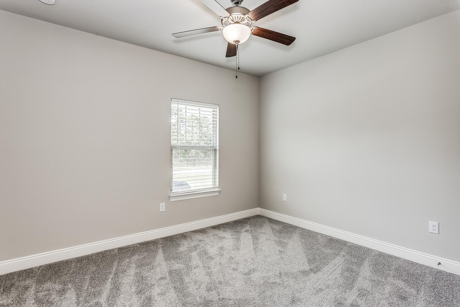6695 Rocky Shores Road Milton, FL 32583 - Photo 33 of 53 an empty room with a window and a fan