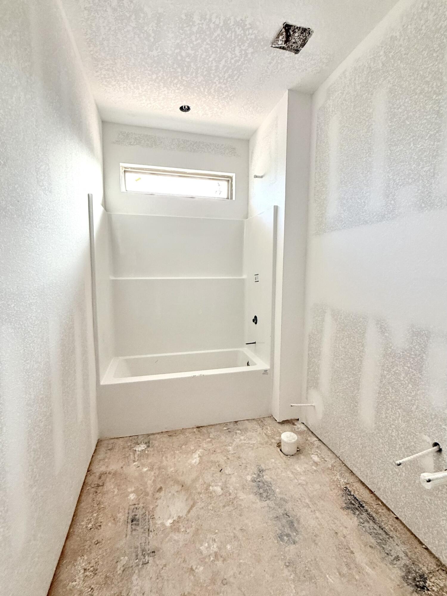 6695 Rocky Shores Road Milton, FL 32583 - Photo 38 of 53 a bathroom with a bathtub and shower