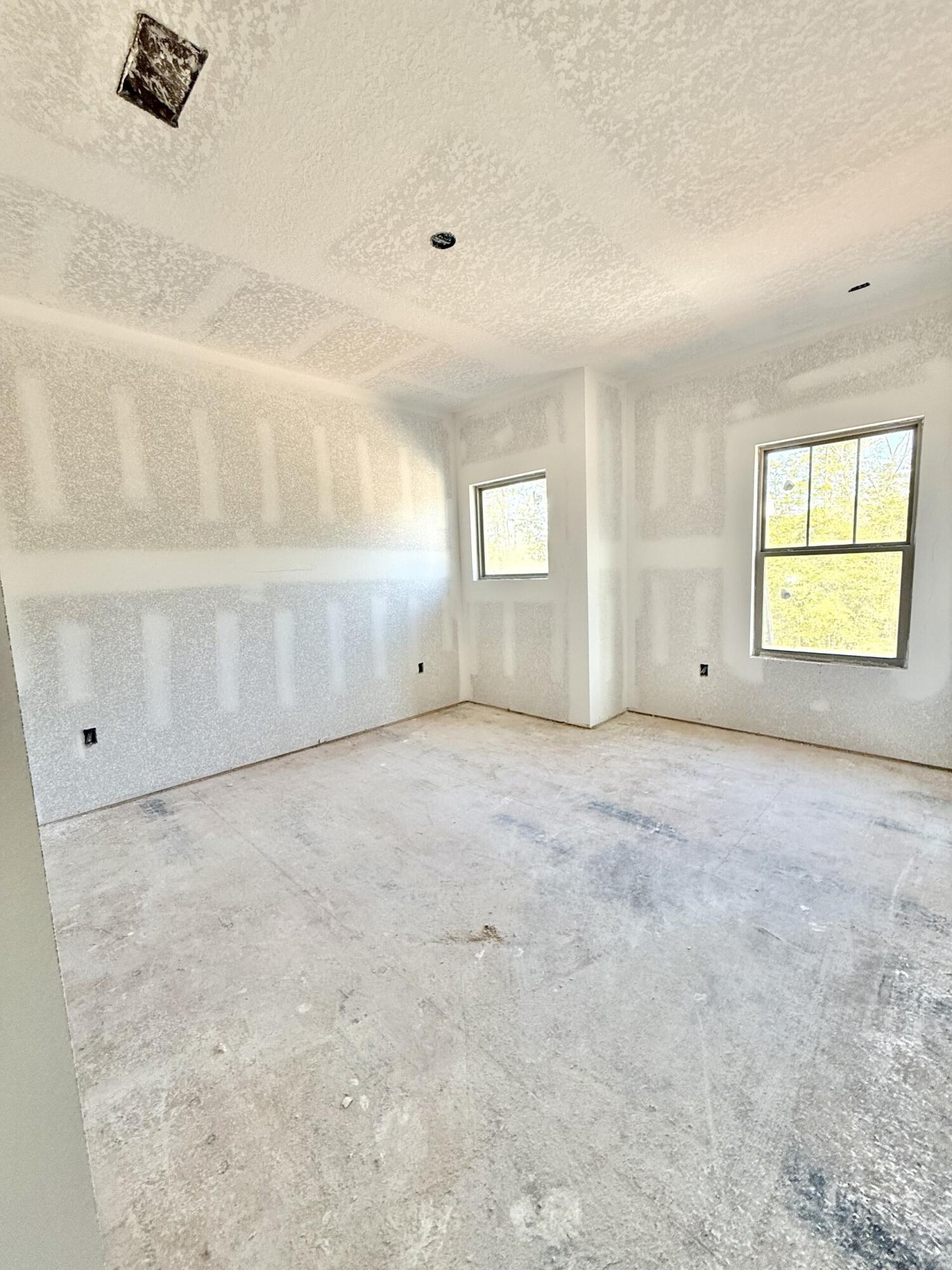6695 Rocky Shores Road Milton, FL 32583 - Photo 41 of 53 an empty room with windows and cabinet