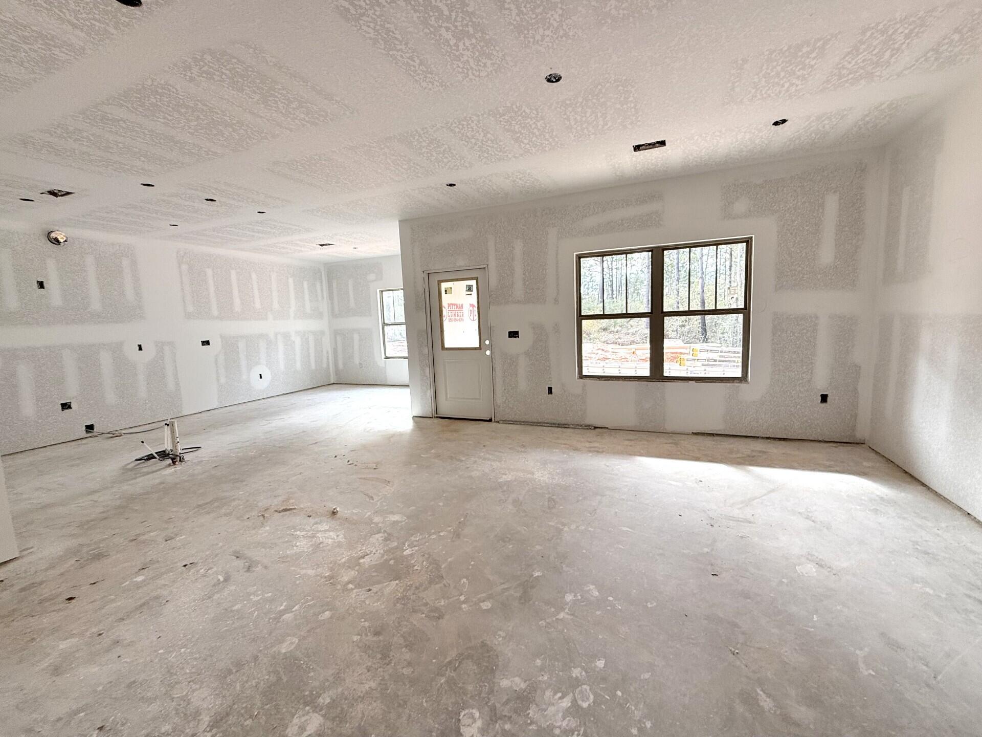 6695 Rocky Shores Road Milton, FL 32583 - Photo 9 of 53 an empty room with white walls and windows
