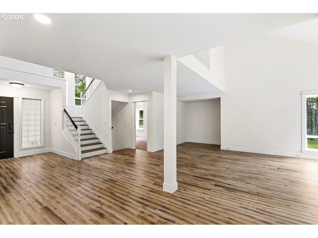 3708 Northeast 292nd Avenue Camas, WA 98607 - Photo 15 of 44 a view of an empty room with wooden floor and stairs