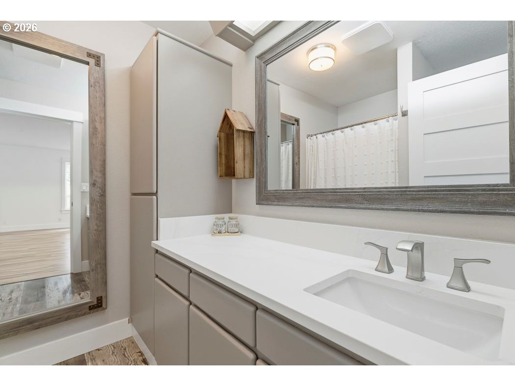 3708 Northeast 292nd Avenue Camas, WA 98607 - Photo 16 of 44 a bathroom with a sink and a mirror