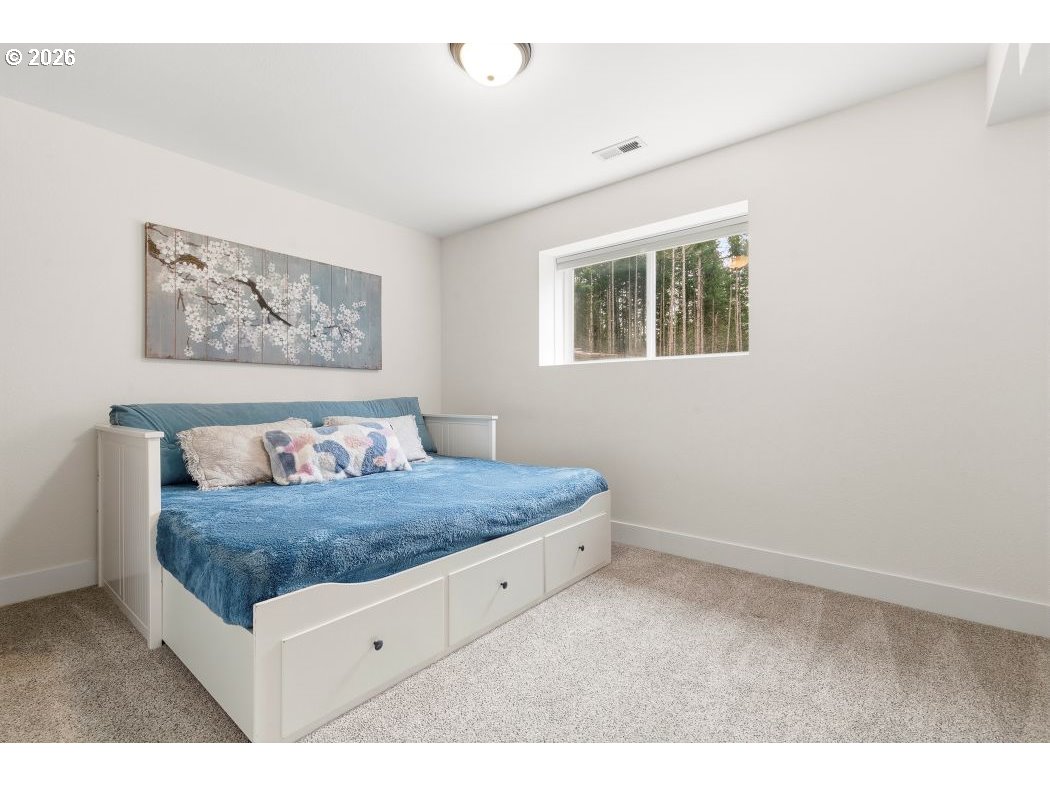 3708 Northeast 292nd Avenue Camas, WA 98607 - Photo 33 of 44 a bedroom with a bed and a painting on the wall