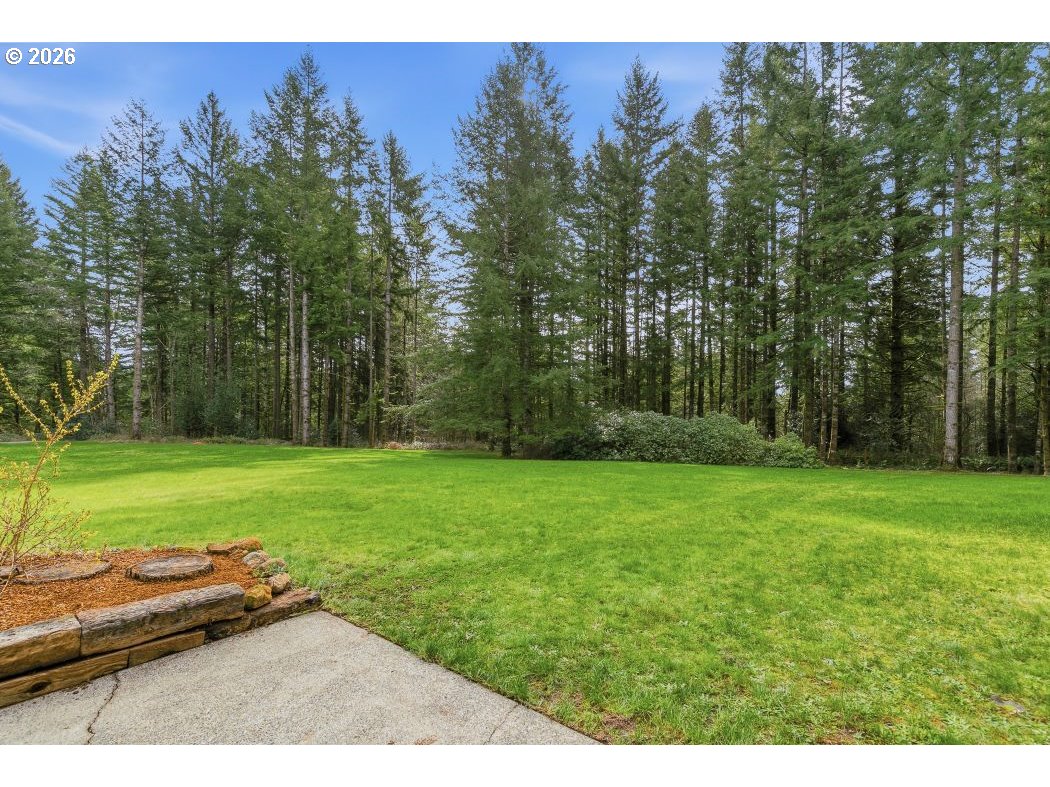 3708 Northeast 292nd Avenue Camas, WA 98607 - Photo 40 of 44 a backyard of a house with lots of green space