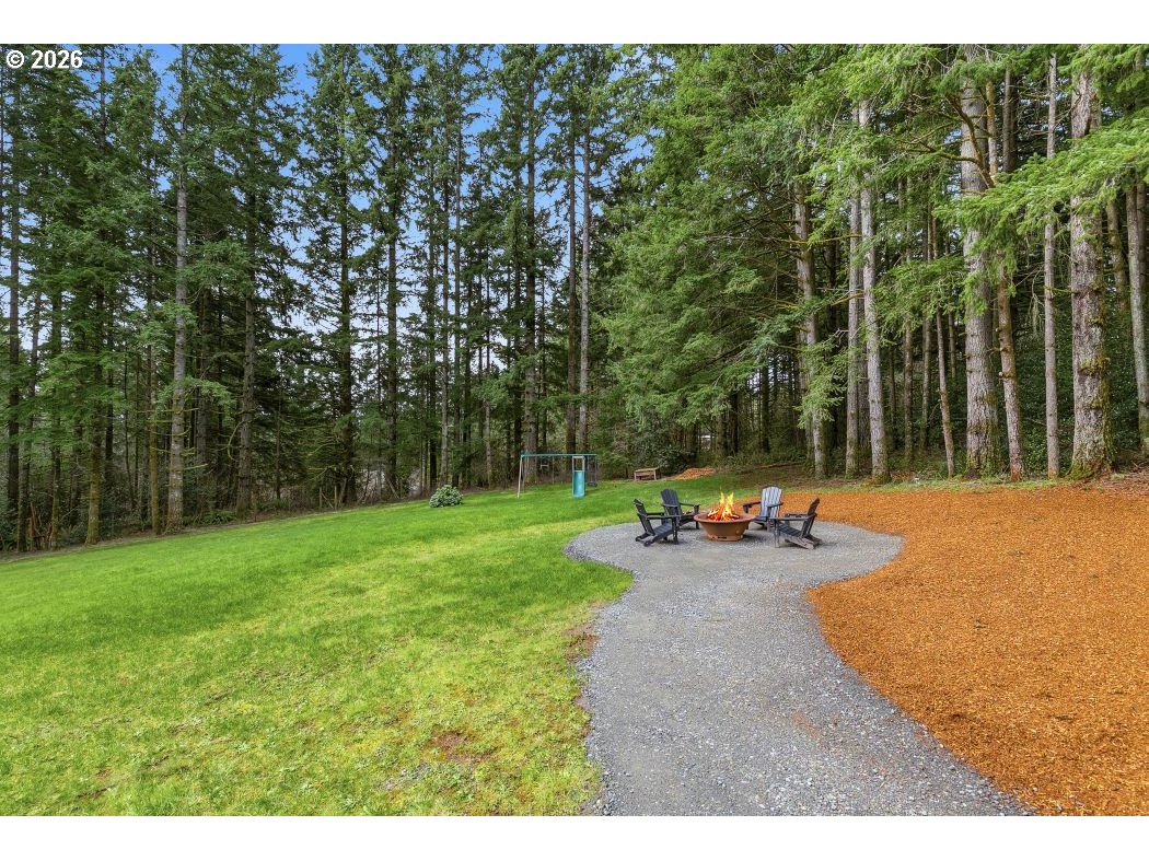 3708 Northeast 292nd Avenue Camas, WA 98607 - Photo 41 of 44 a backyard of a house with table and chairs