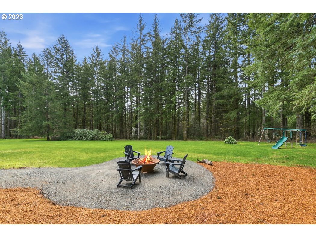 3708 Northeast 292nd Avenue Camas, WA 98607 - Photo 42 of 44 a view of a backyard with sitting area and garden