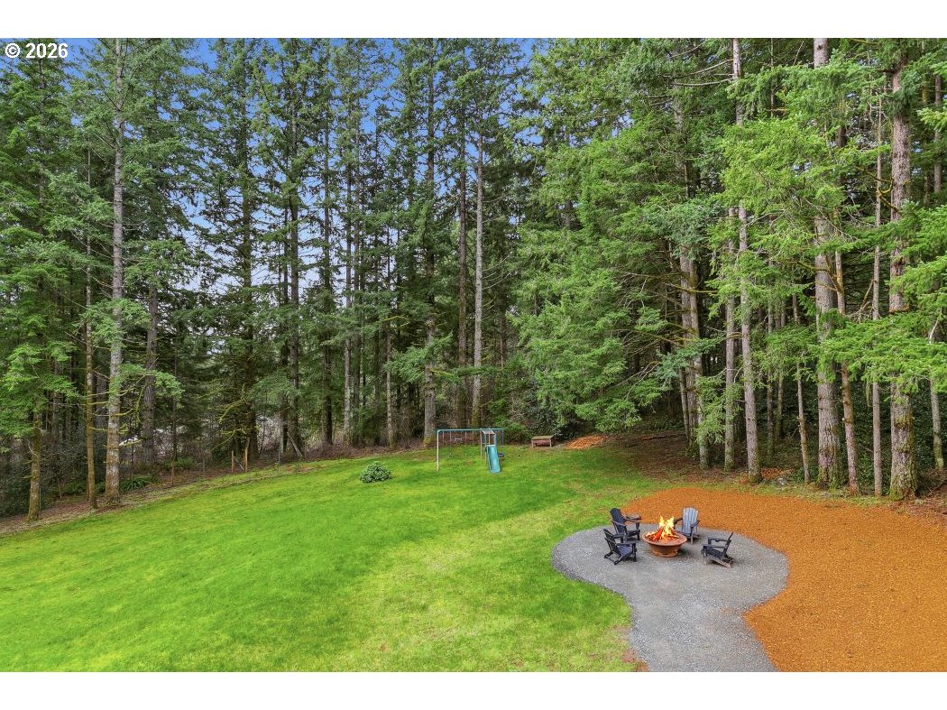 3708 Northeast 292nd Avenue Camas, WA 98607 - Photo 43 of 44 a backyard of a house with table and chairs