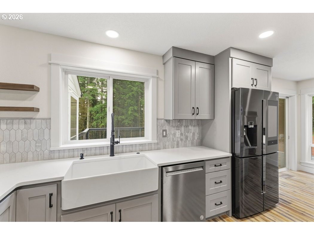 3708 Northeast 292nd Avenue Camas, WA 98607 - Photo 8 of 44 a kitchen with a sink a refrigerator and a sink