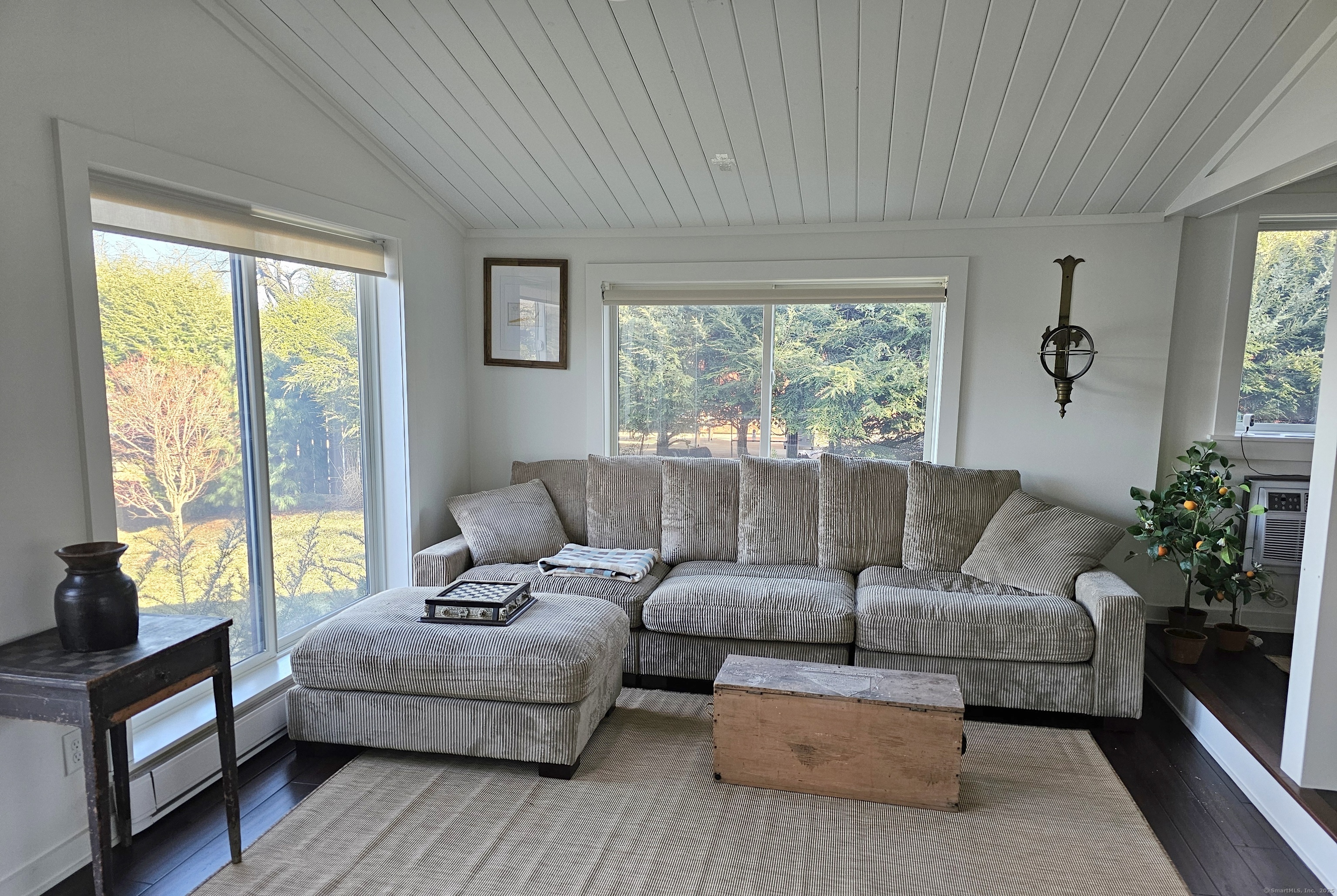 112 West Lake Road, Unit 112 Woodbury, CT 06798 - Photo 14 of 34 a living room with furniture and a large window