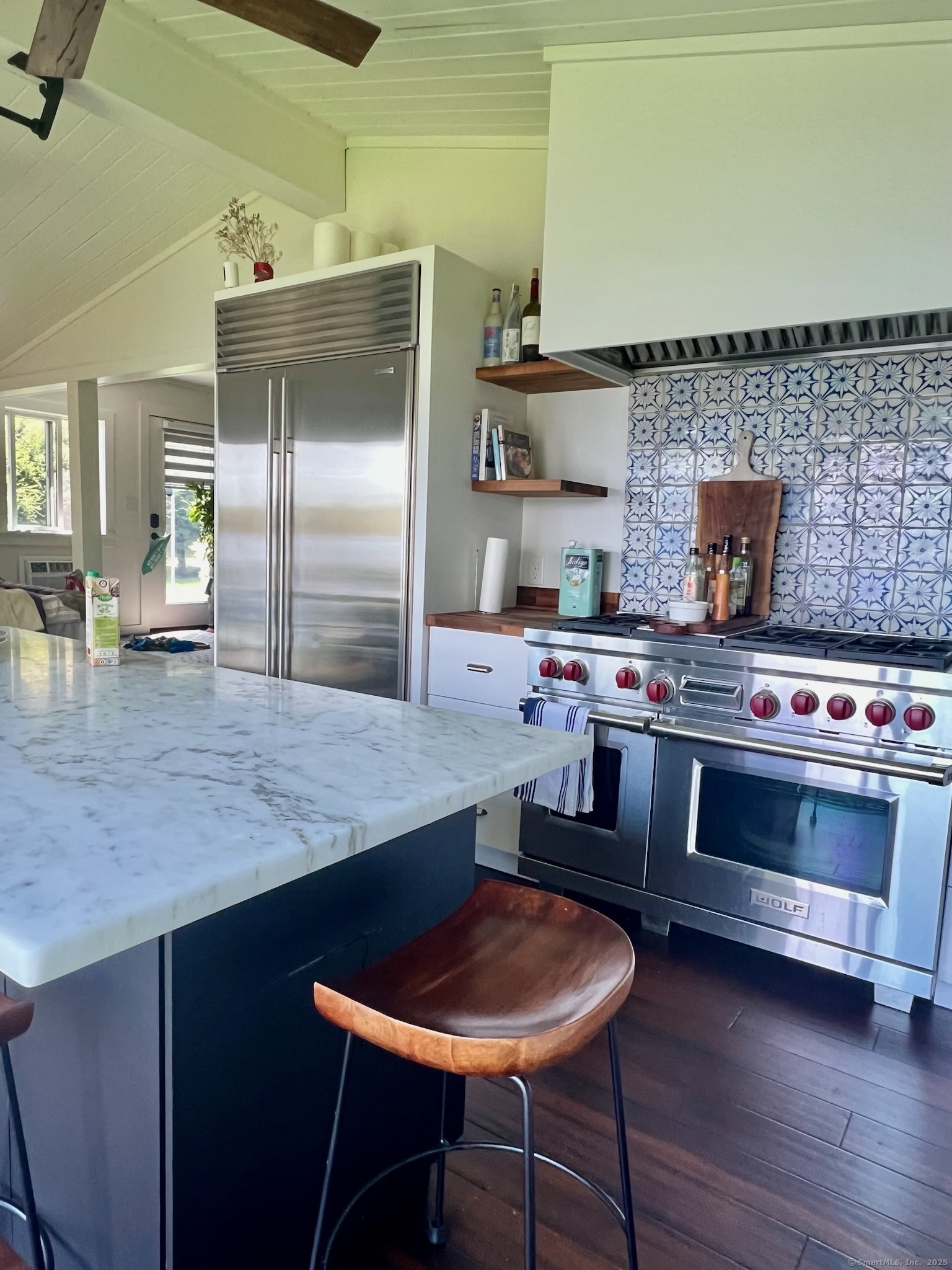 112 West Lake Road, Unit 112 Woodbury, CT 06798 - Photo 20 of 34 a kitchen with stainless steel appliances wooden cabinets and a stove top oven