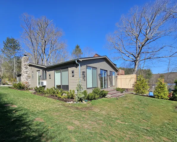 a backyard of a house with lots of green space