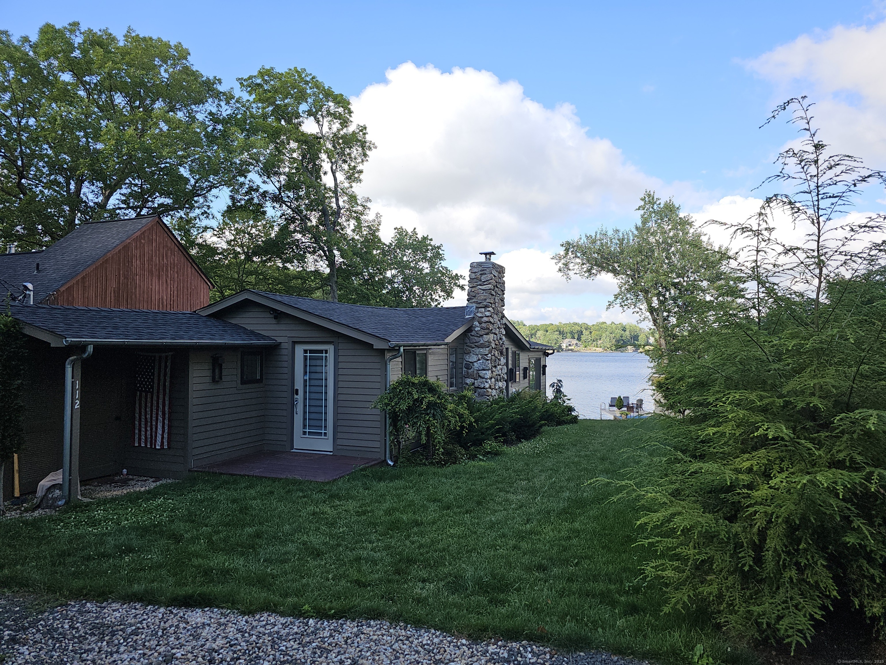 112 West Lake Road, Unit 112 Woodbury, CT 06798 - Photo 29 of 34 a view of a house with a backyard