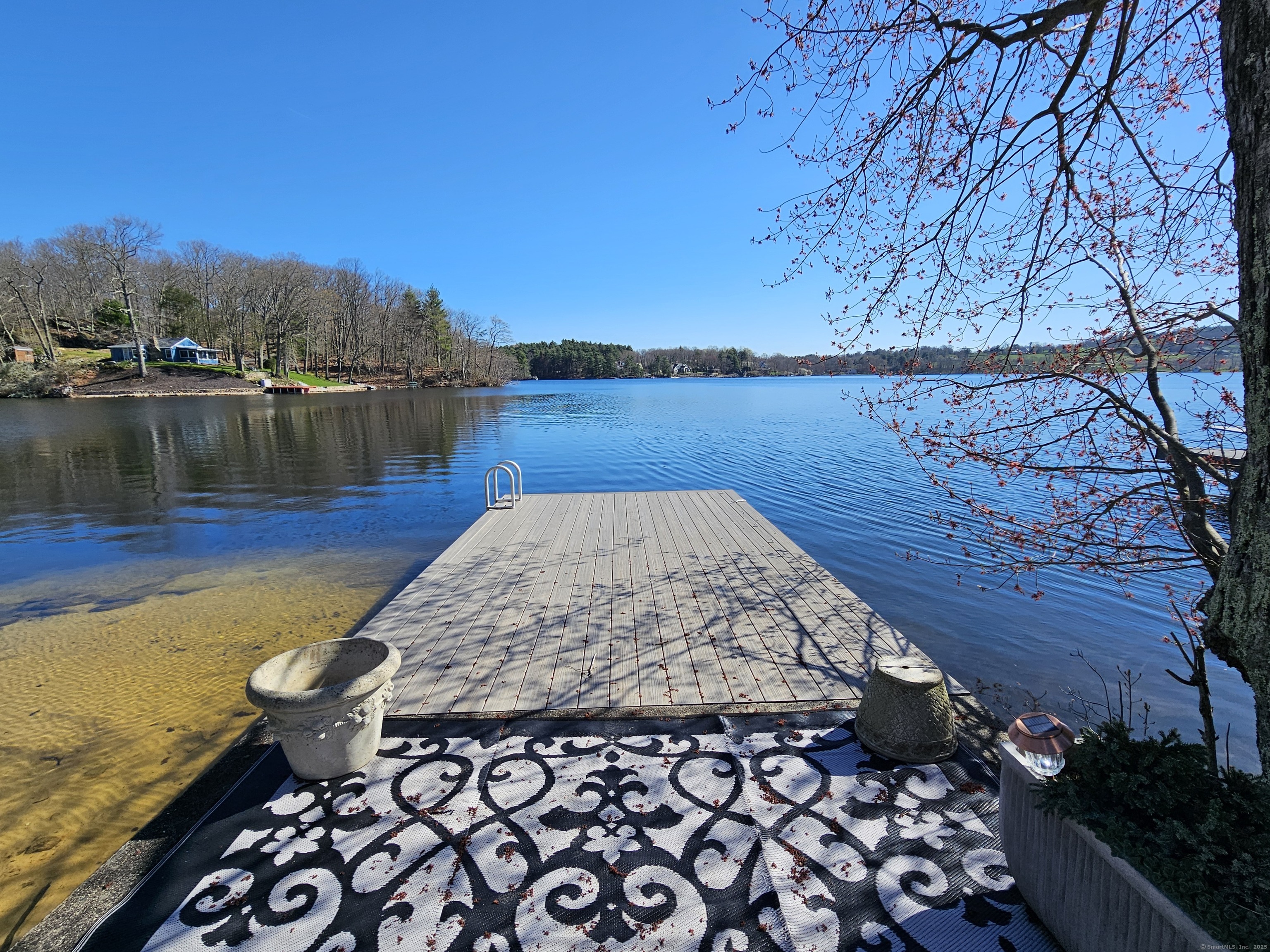112 West Lake Road, Unit 112 Woodbury, CT 06798 - Photo 8 of 34 a view of a lake with a mountain